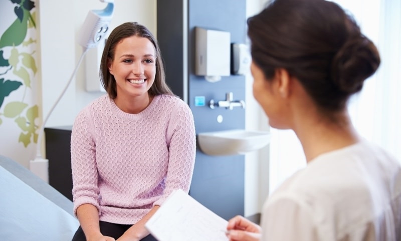 Doctor speaking with female patient